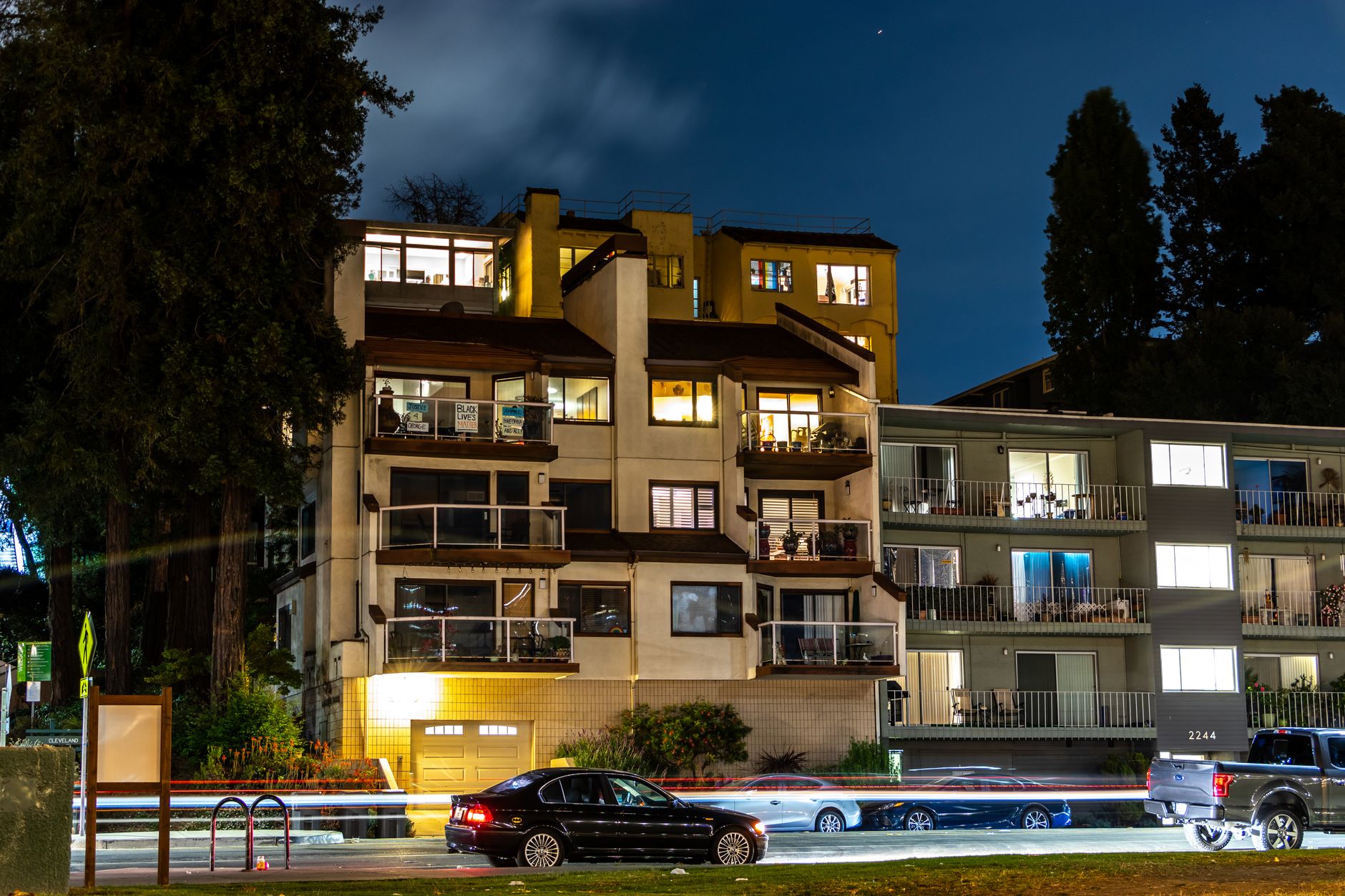 Exterior modern Revere Apartments with landscaped garden and balcony view, ideal urban living space.