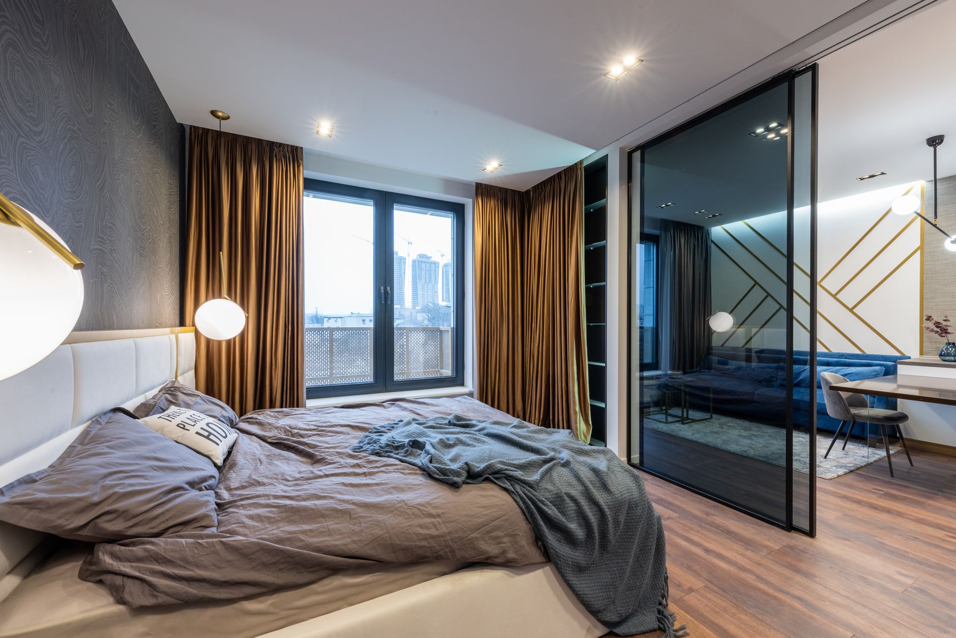 Luxury studio apartments near me, interior sleek dengan jendela besar, lokasi pusat kota, nyaman dan bergaya.