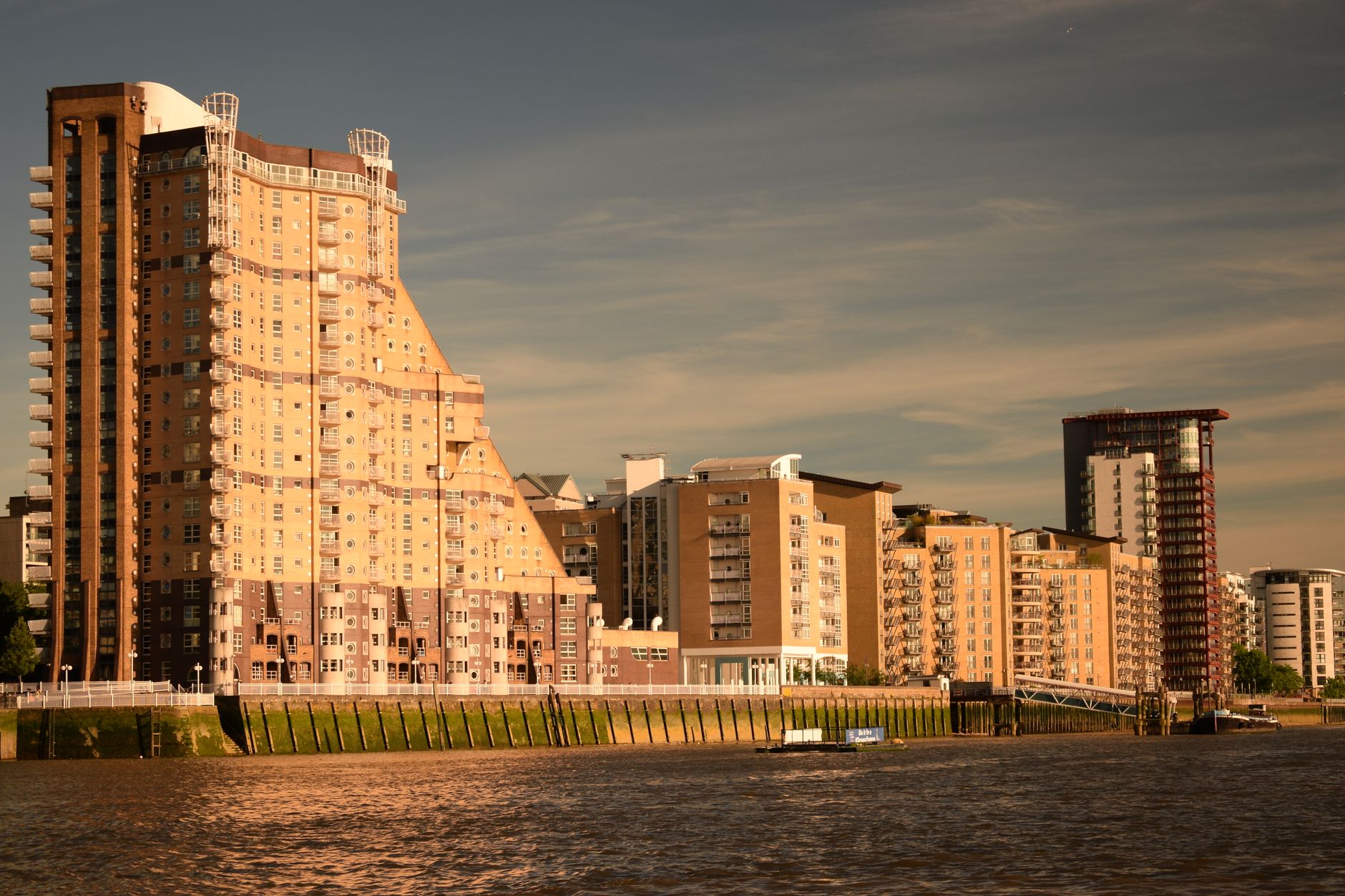 Exterior view of The Highbank Luxury Apartments showcasing modern architecture and skyline.