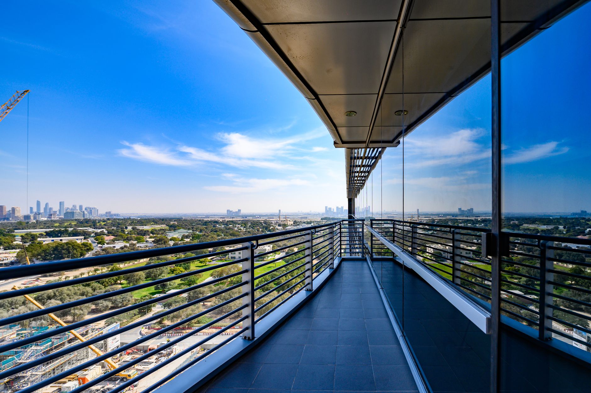 Exterior modern La Vista Apartments with landscaped garden and pool, showcasing sleek architecture.