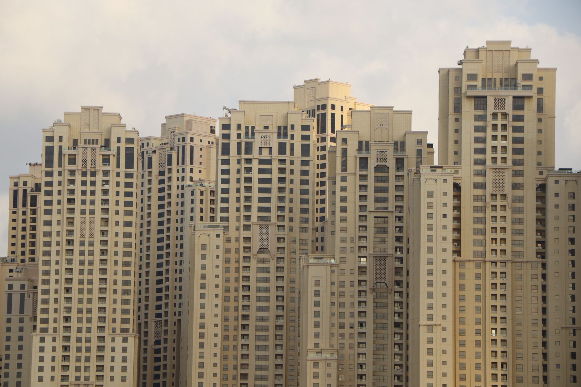Modern great apartments interior showing spacious living room, large windows, and city skyline view