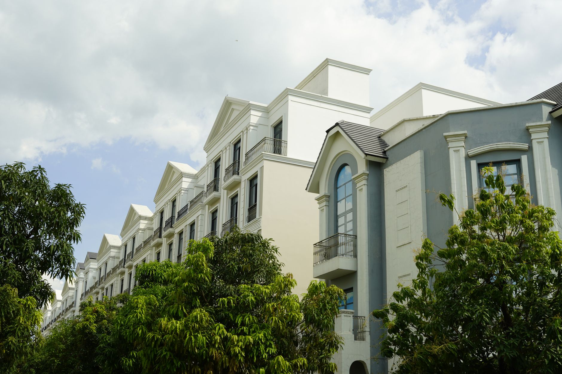 Exterior view of Brookhaven Luxury Apartments showcasing modern design, upscale amenities, and scenic city backdrop