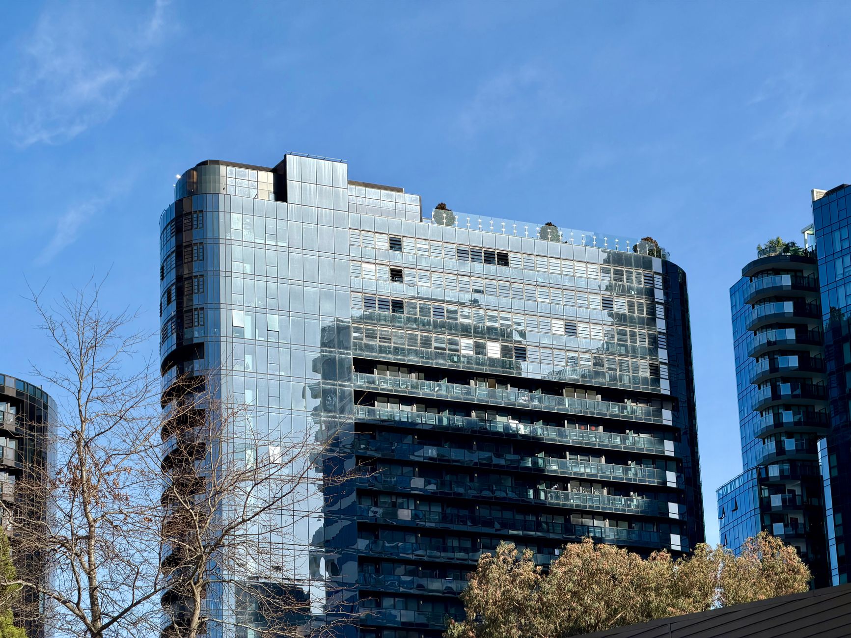 Exterior modern hidden hills apartments with landscaped gardens and panoramic city view