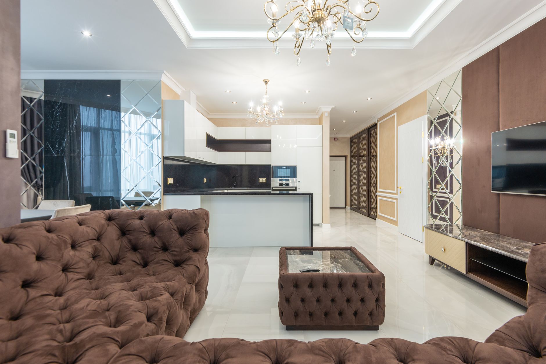 Spacious luxury city center apartment with floor-to-ceiling windows and modern furnishings.